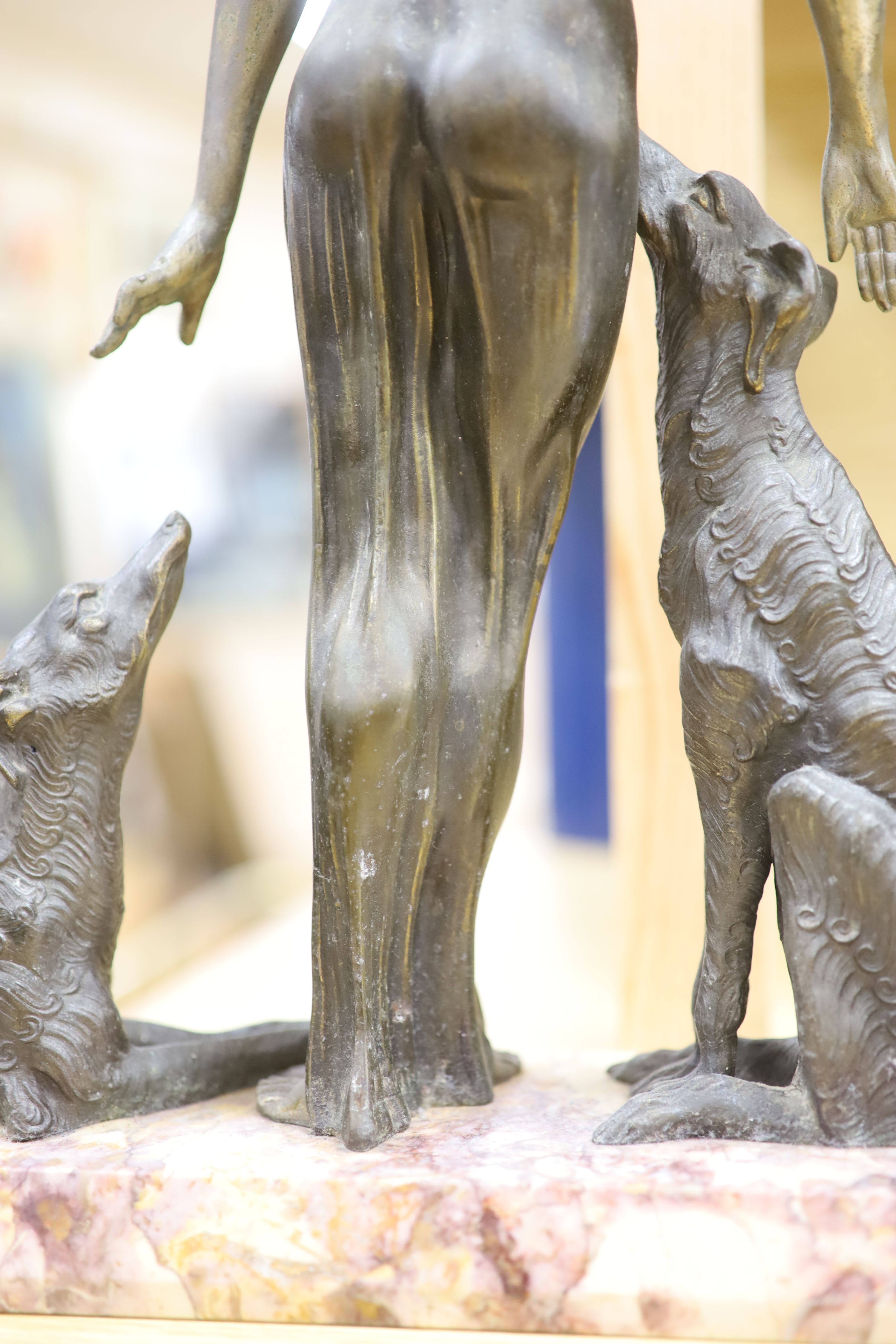 A Spelter Art Deco figure of a dog and borzoi, on a marble base, height 45cm